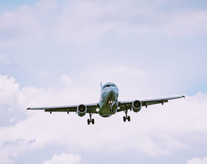 Beautiful view of an airplane flying in a cloudy sky A beautiful view of an airplane flying in a cloudy sky